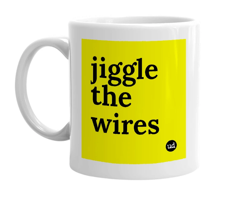 White mug with 'jiggle the wires' in bold black letters