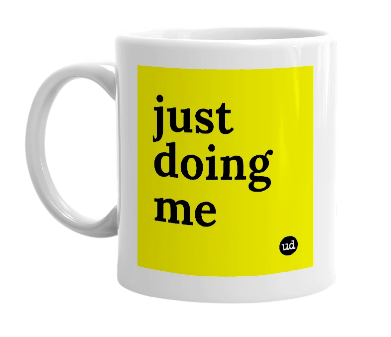 White mug with 'just doing me' in bold black letters