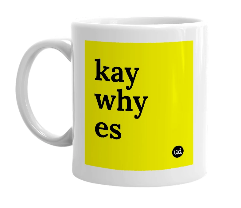 White mug with 'kay why es' in bold black letters