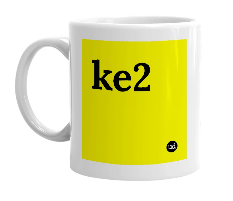 White mug with 'ke2' in bold black letters