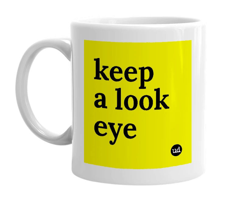 White mug with 'keep a look eye' in bold black letters