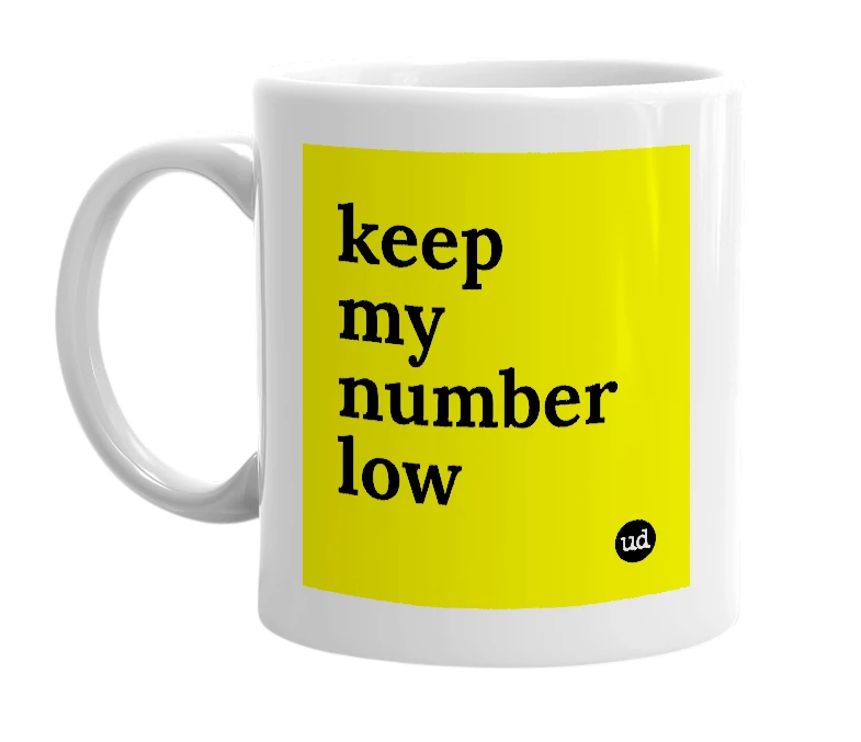 White mug with 'keep my number low' in bold black letters