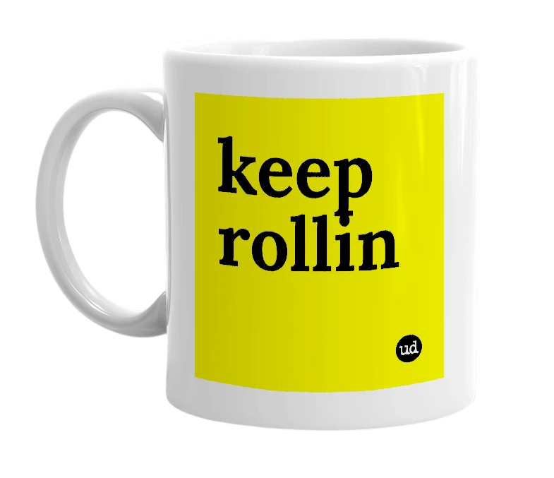 White mug with 'keep rollin' in bold black letters