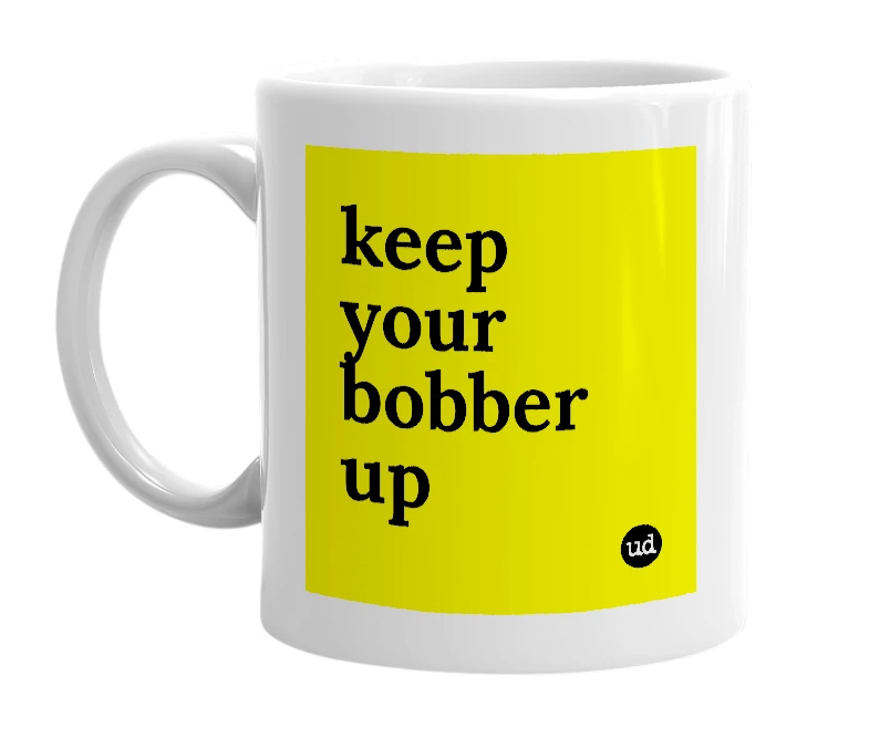 White mug with 'keep your bobber up' in bold black letters