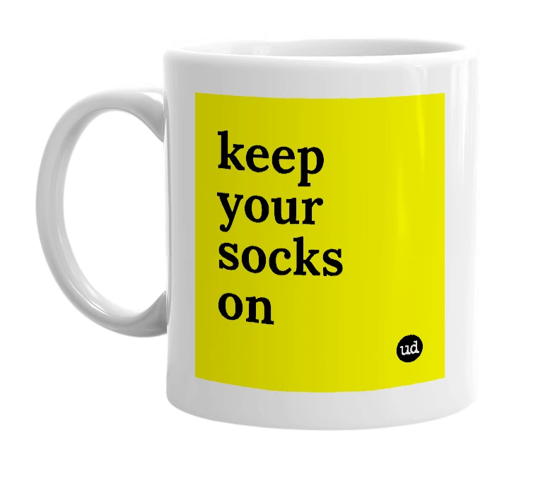 White mug with 'keep your socks on' in bold black letters