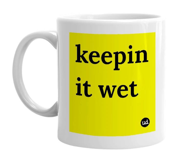 White mug with 'keepin it wet' in bold black letters