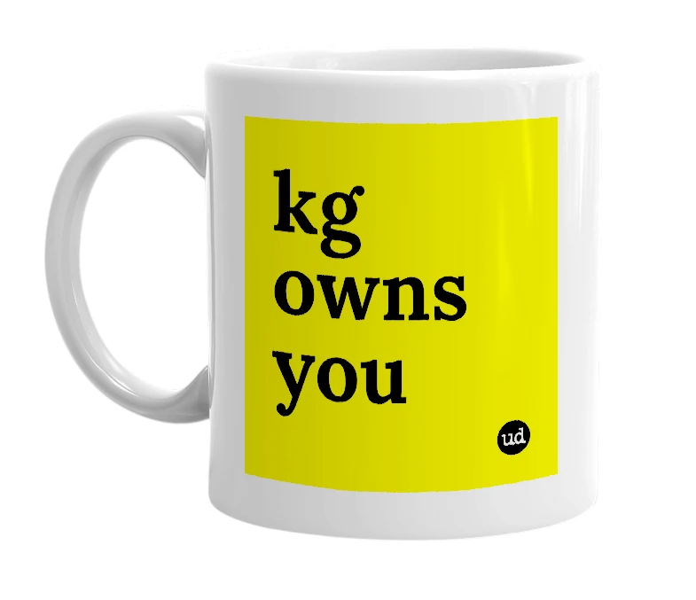 White mug with 'kg owns you' in bold black letters