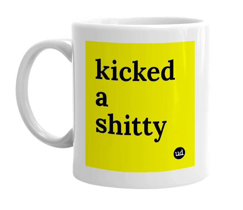 White mug with 'kicked a shitty' in bold black letters