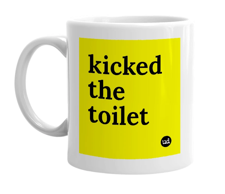 White mug with 'kicked the toilet' in bold black letters