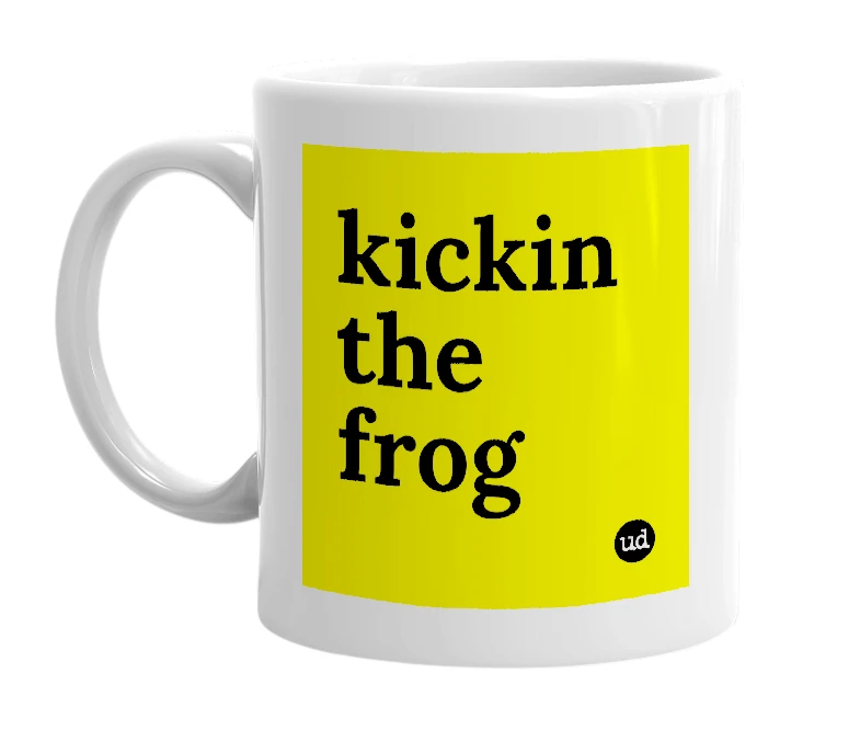 White mug with 'kickin the frog' in bold black letters