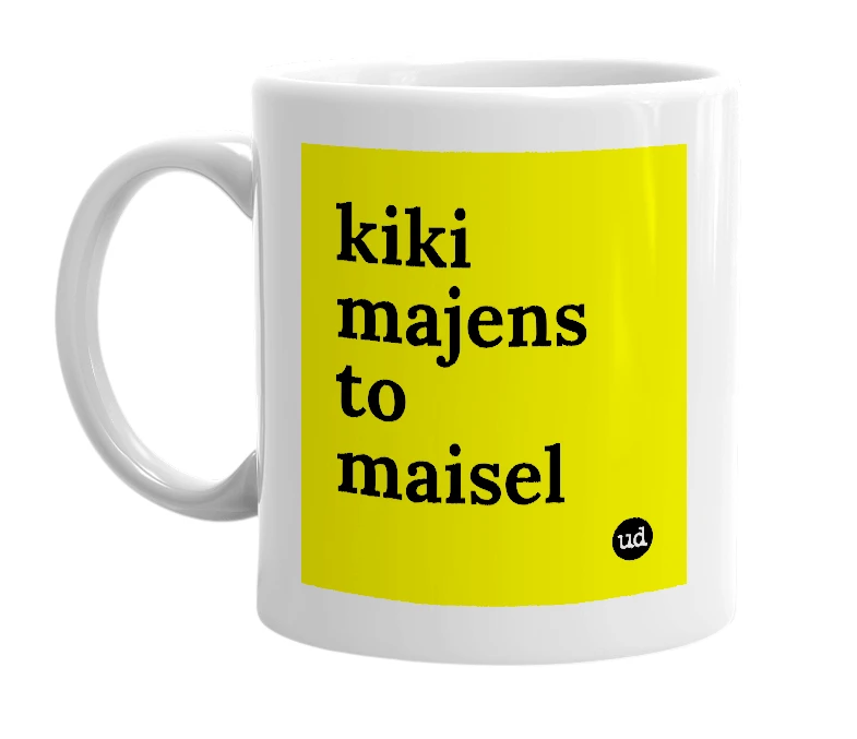 White mug with 'kiki majens to maisel' in bold black letters