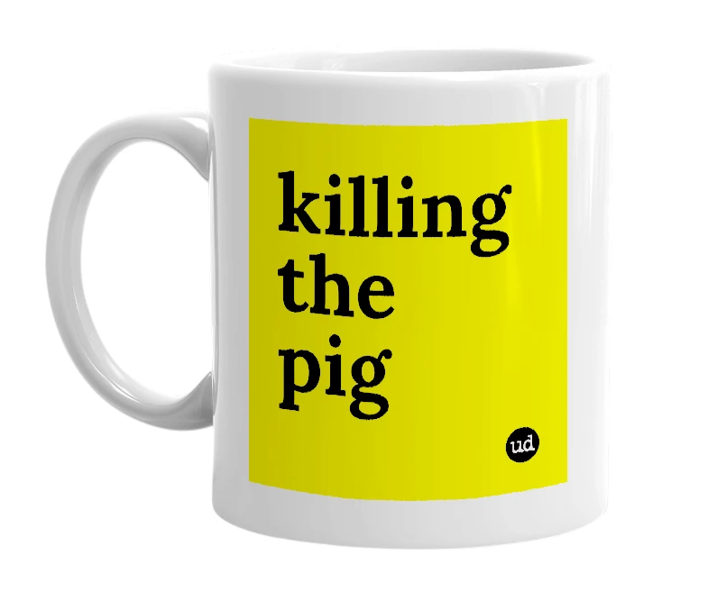 White mug with 'killing the pig' in bold black letters