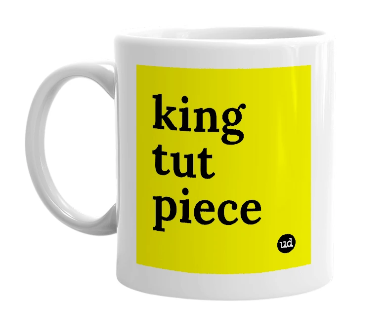 White mug with 'king tut piece' in bold black letters