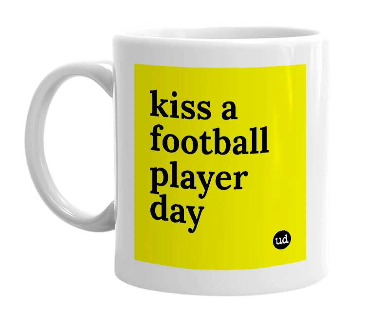 White mug with 'kiss a football player day' in bold black letters