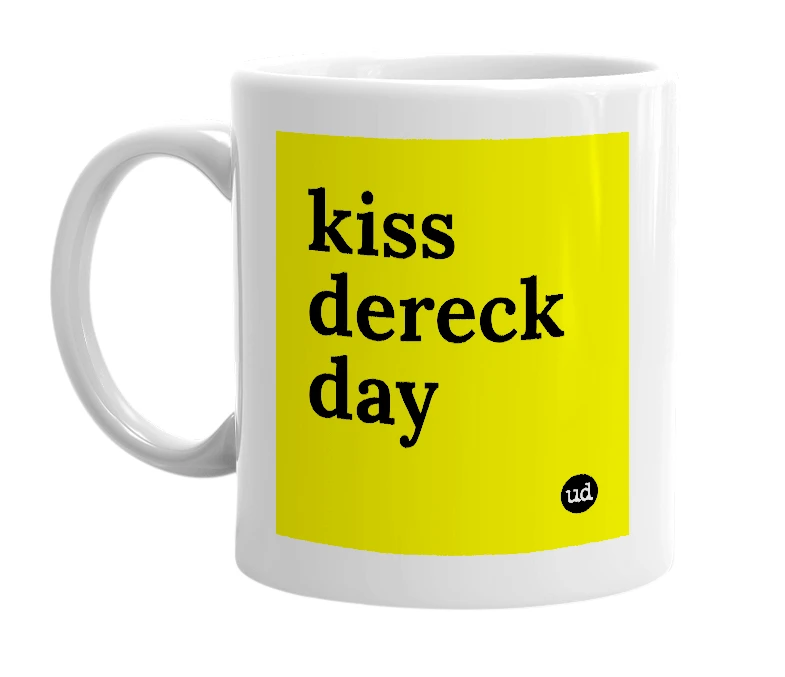 White mug with 'kiss dereck day' in bold black letters
