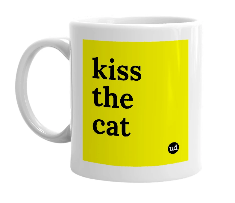 White mug with 'kiss the cat' in bold black letters