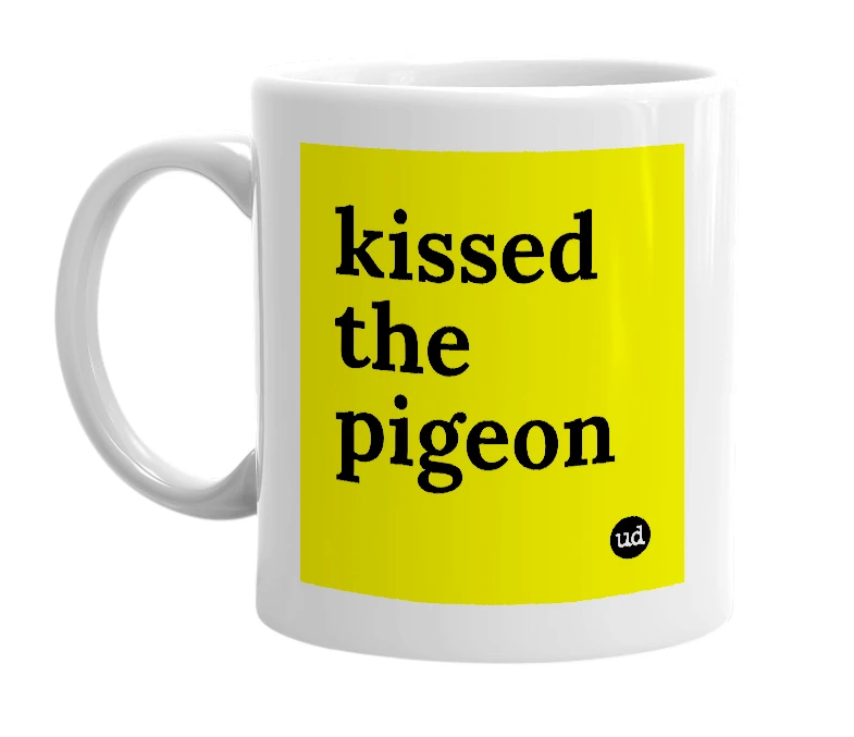 White mug with 'kissed the pigeon' in bold black letters