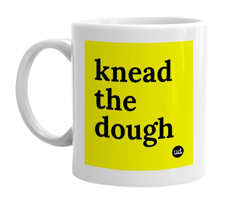 White mug with 'knead the dough' in bold black letters