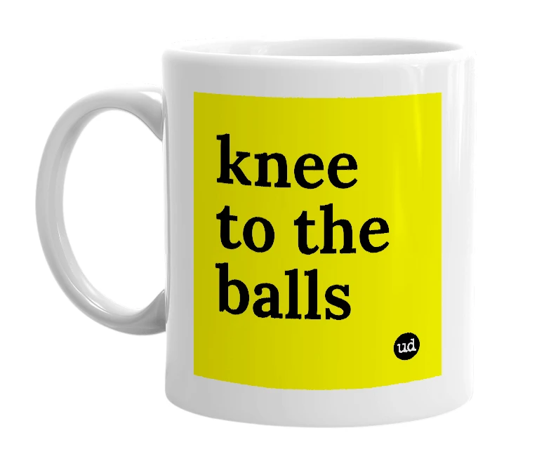 White mug with 'knee to the balls' in bold black letters