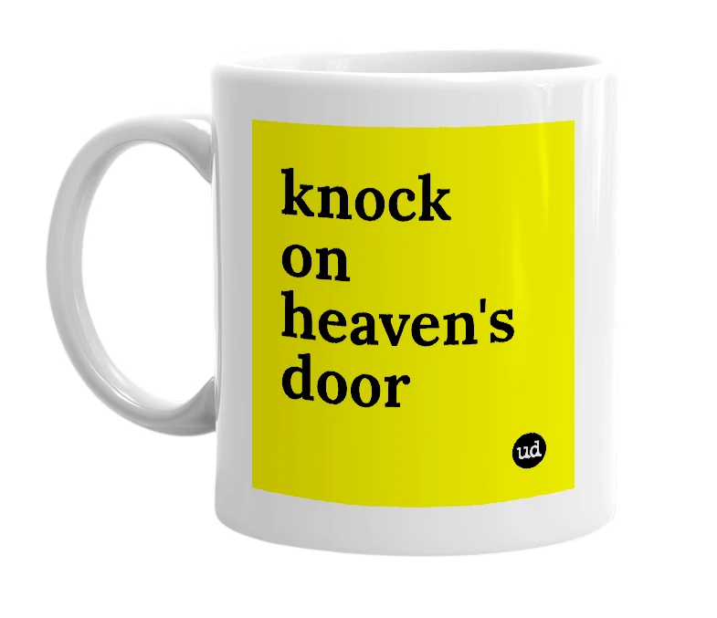 White mug with 'knock on heaven's door' in bold black letters