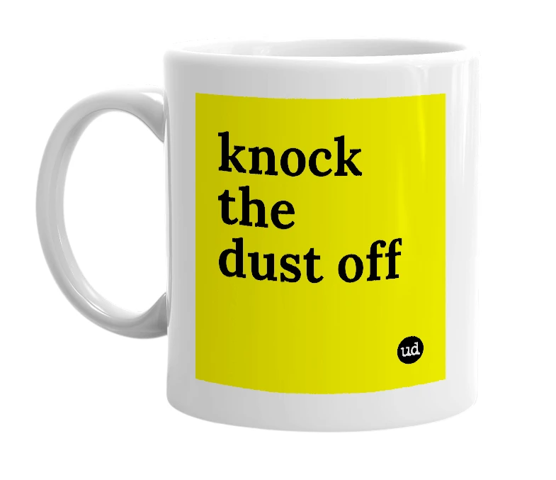 White mug with 'knock the dust off' in bold black letters