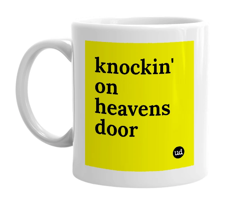 White mug with 'knockin' on heavens door' in bold black letters