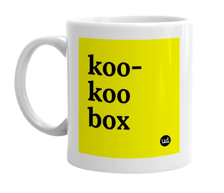 White mug with 'koo-koo box' in bold black letters