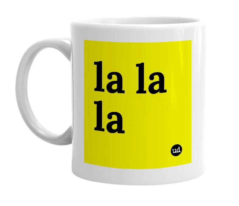 White mug with 'la la la' in bold black letters