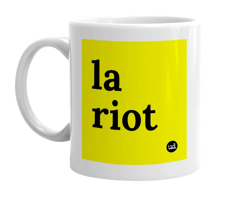 White mug with 'la riot' in bold black letters