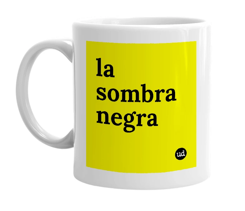 White mug with 'la sombra negra' in bold black letters
