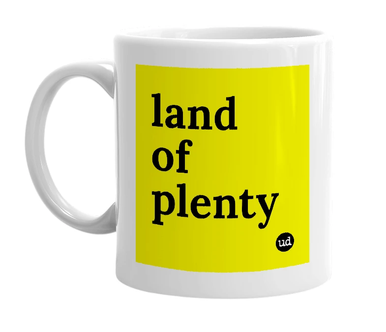 White mug with 'land of plenty' in bold black letters