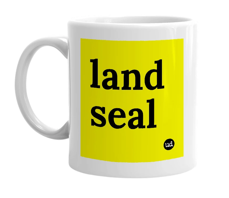 White mug with 'land seal' in bold black letters