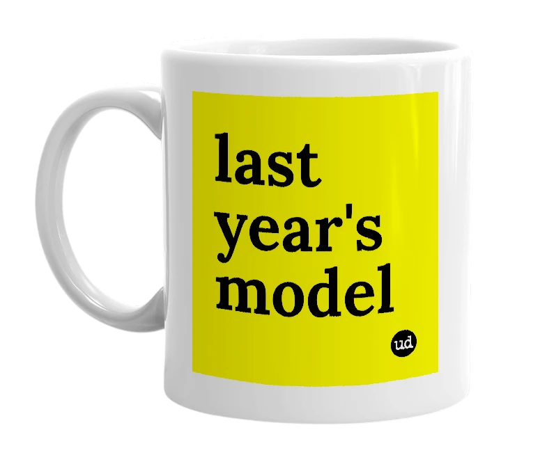 White mug with 'last year's model' in bold black letters