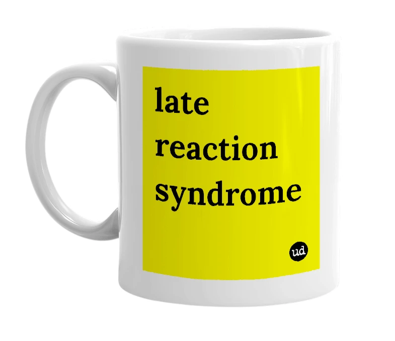 White mug with 'late reaction syndrome' in bold black letters