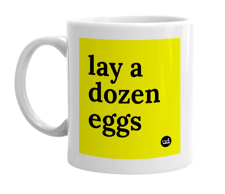 White mug with 'lay a dozen eggs' in bold black letters