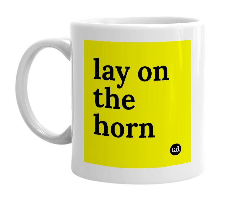 White mug with 'lay on the horn' in bold black letters