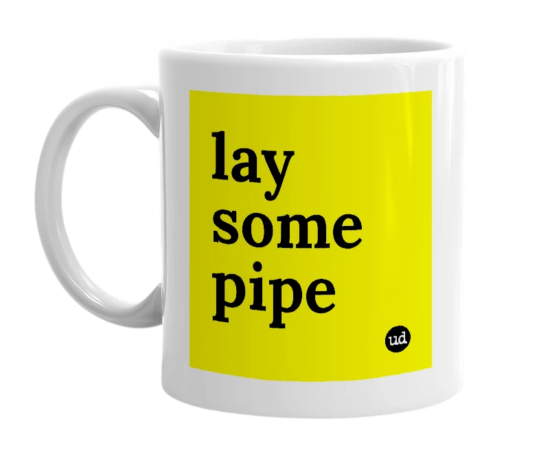White mug with 'lay some pipe' in bold black letters
