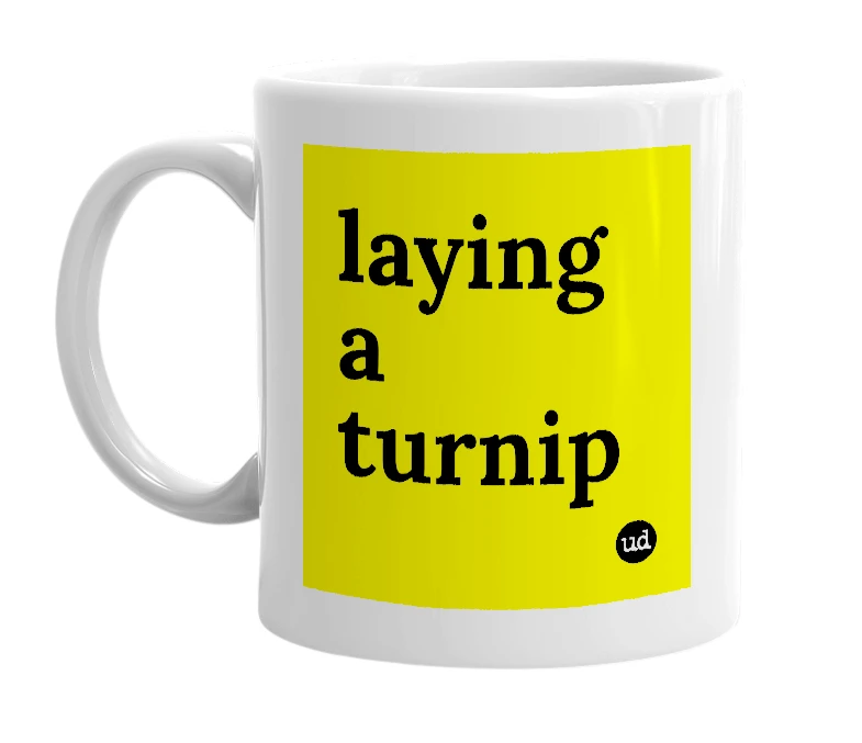 White mug with 'laying a turnip' in bold black letters