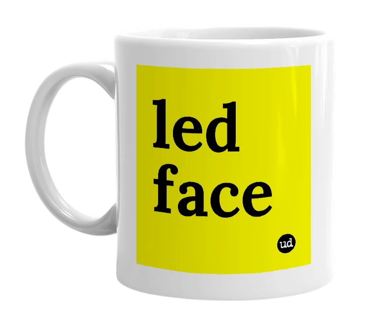 White mug with 'led face' in bold black letters