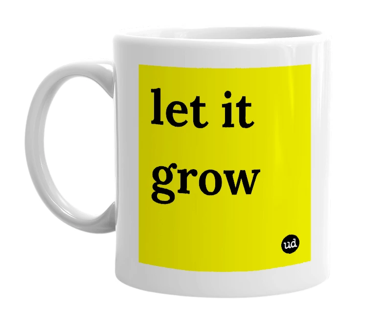White mug with 'let it grow' in bold black letters