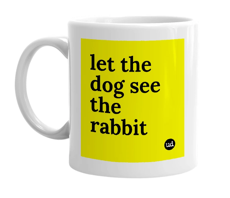 White mug with 'let the dog see the rabbit' in bold black letters