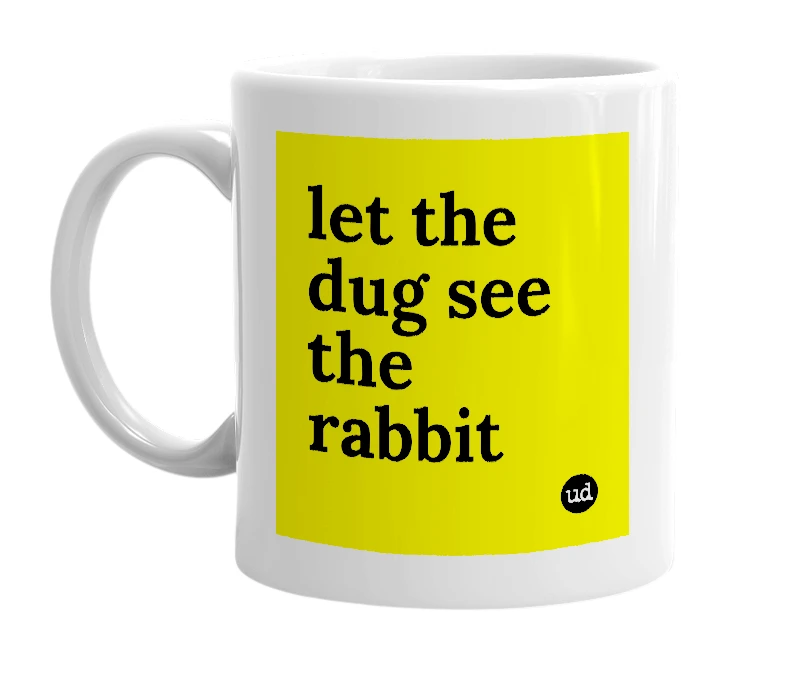 White mug with 'let the dug see the rabbit' in bold black letters