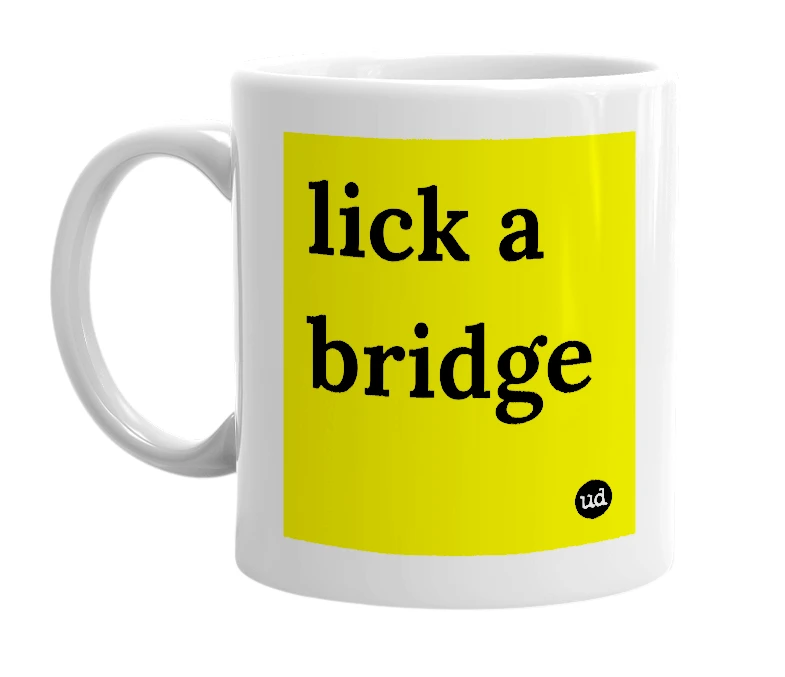 White mug with 'lick a bridge' in bold black letters