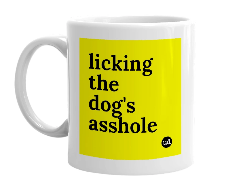 White mug with 'licking the dog's asshole' in bold black letters