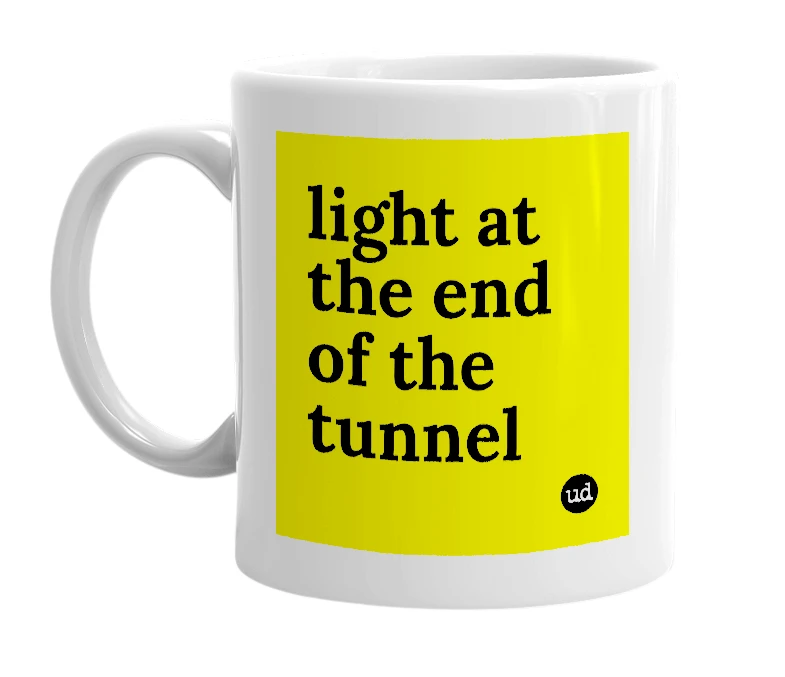 White mug with 'light at the end of the tunnel' in bold black letters
