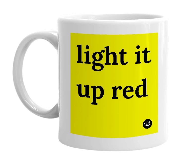 White mug with 'light it up red' in bold black letters