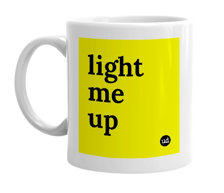 White mug with 'light me up' in bold black letters