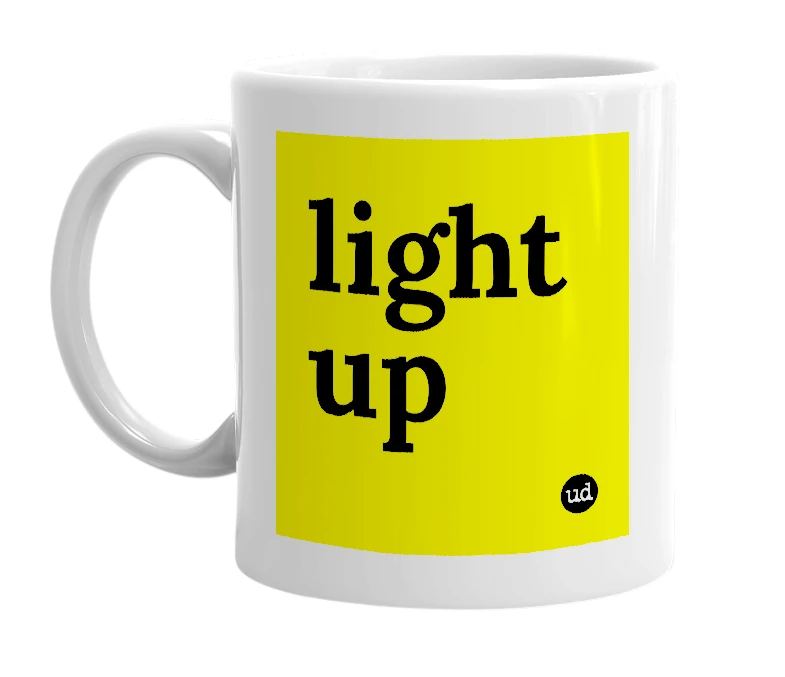 White mug with 'light up' in bold black letters