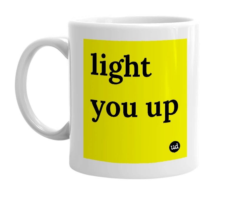 White mug with 'light you up' in bold black letters
