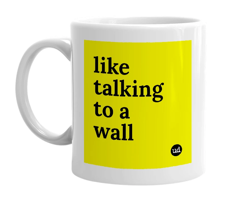 White mug with 'like talking to a wall' in bold black letters